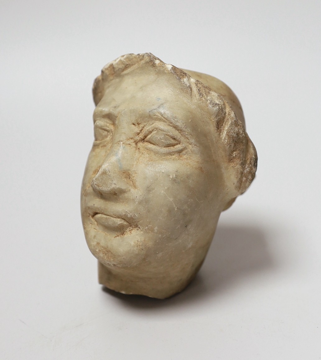 A marble head of a man in Hellenistic style, 12cm long